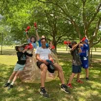 students holding nerf guns