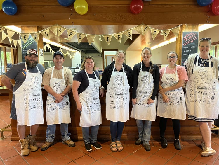 a picture of our p and c with their aprons on